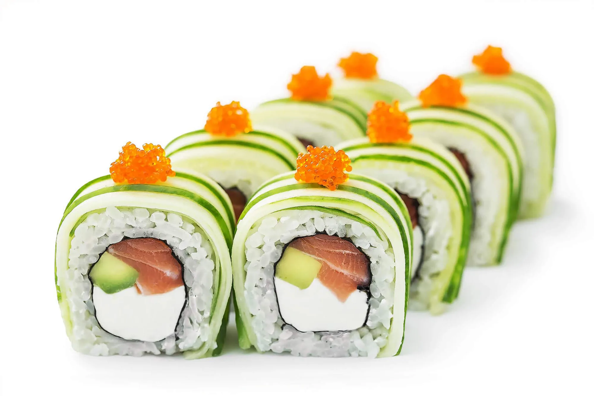 Salmon avocado sushi rolls in cucumber with tobiko, by Alex Slyadnev