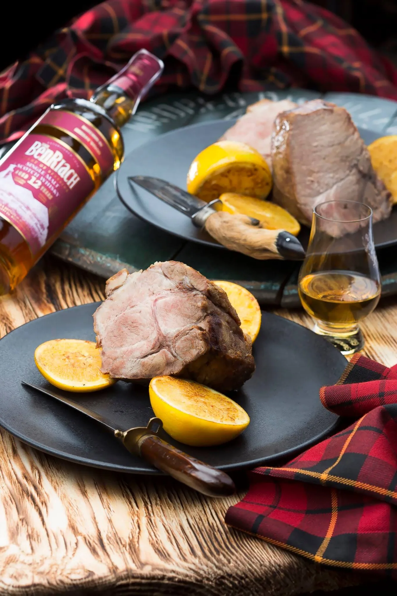 Roast pork with grilled lemon and a glass of BenRiach whisky, photo by Alex Slyadnev