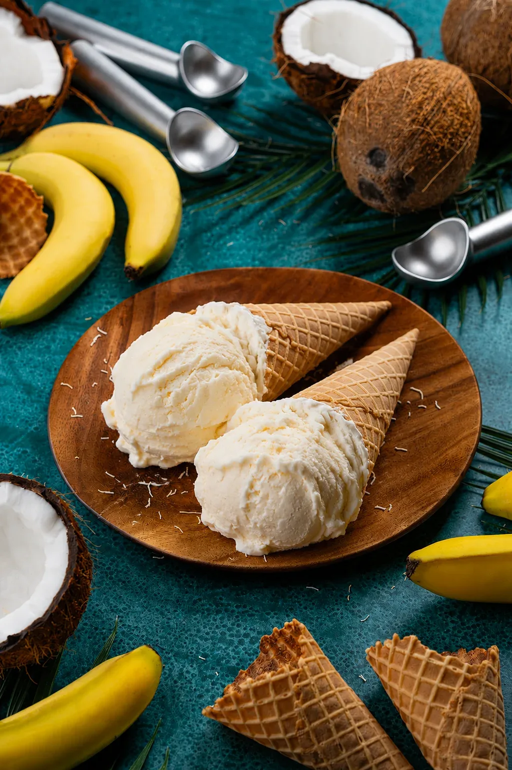 Coconut banana ice cream with waffle cones on a wooden plate, photo by Alex Slyadnev